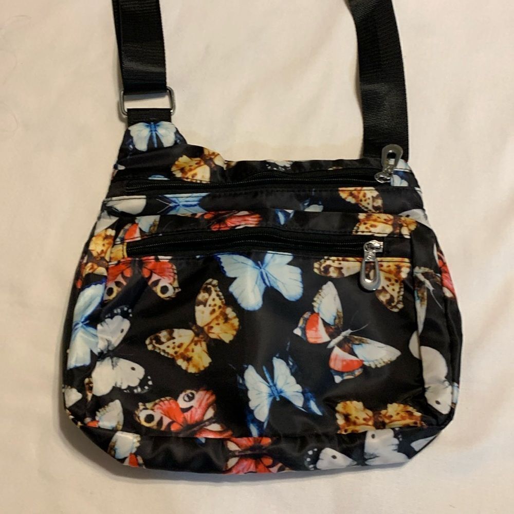 Soyater multi zipper compartment crossbody novelty nylon bag w/butterfly detail.